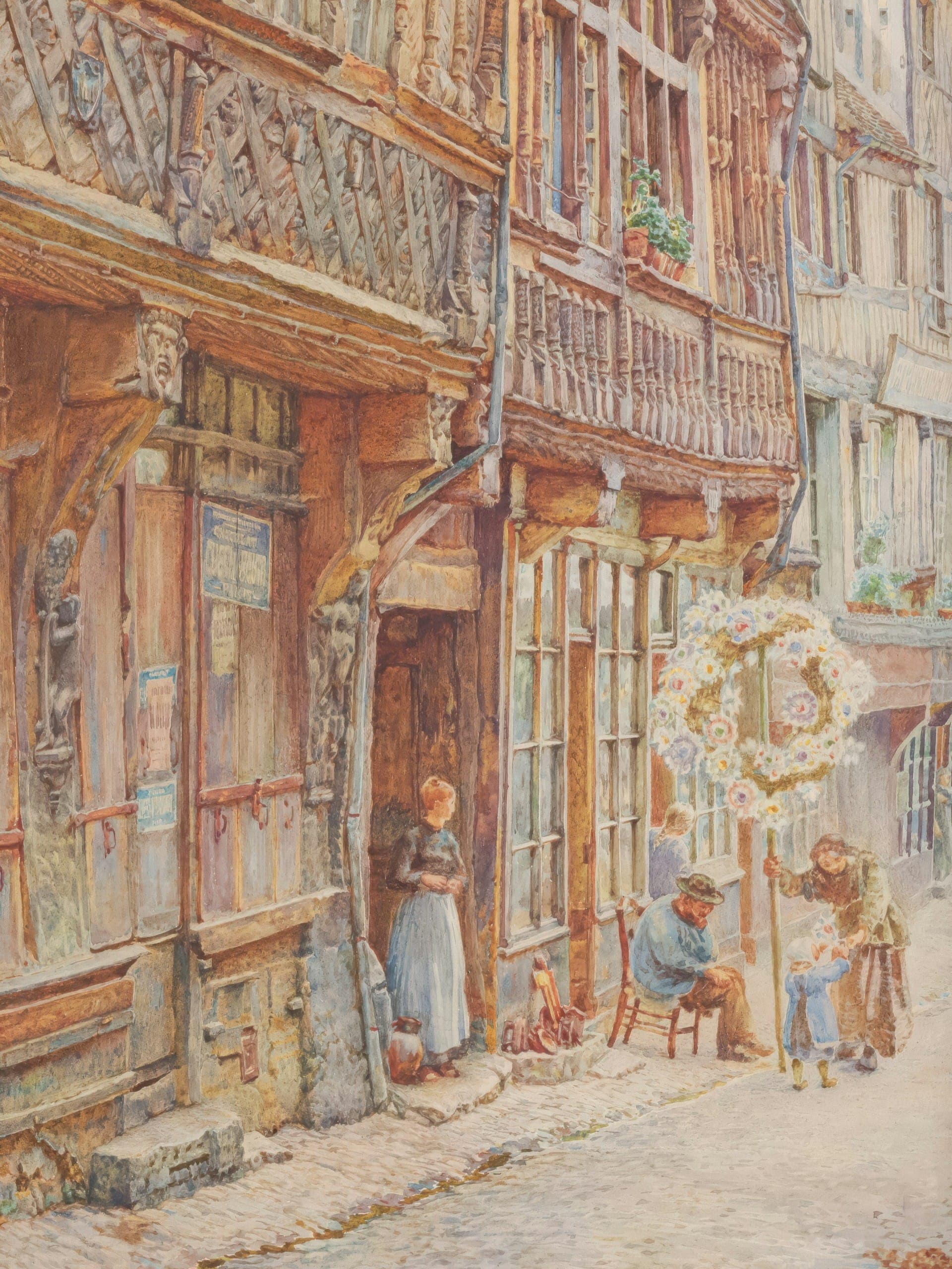 A street scene with medieval buildings, people interacting, and a large floral wreath in a quaint, cobblestone alley.