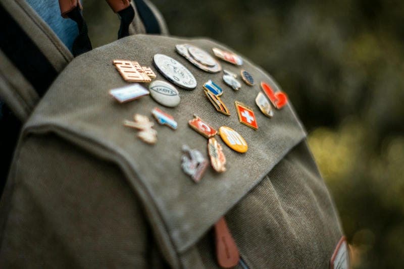 country pins on backpack
