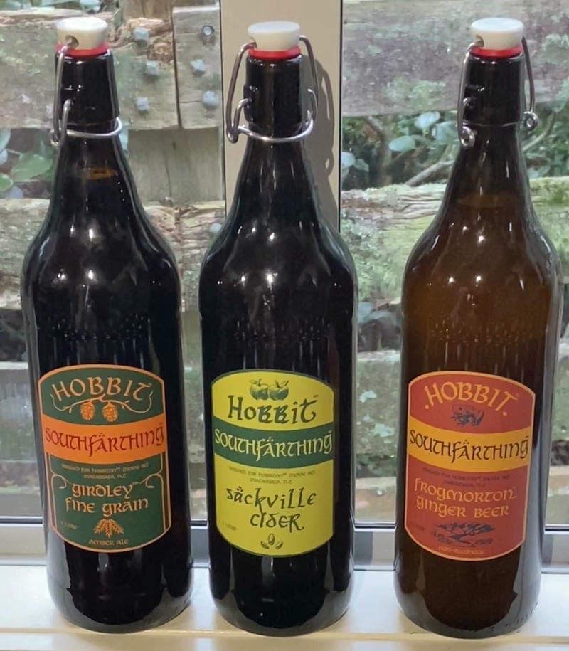 Three bottles of Hobbit Southfarthing beverages: Girdley Fine Grain, Sackville Cider, and Frogmorton Ginger Beer.