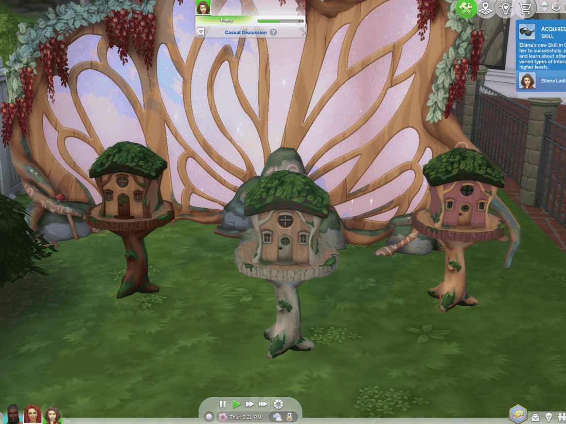 The Sims 4 Fairy House Three whimsical treehouse miniatures with leaf roofs sit in a lush garden, part of a video game interface.